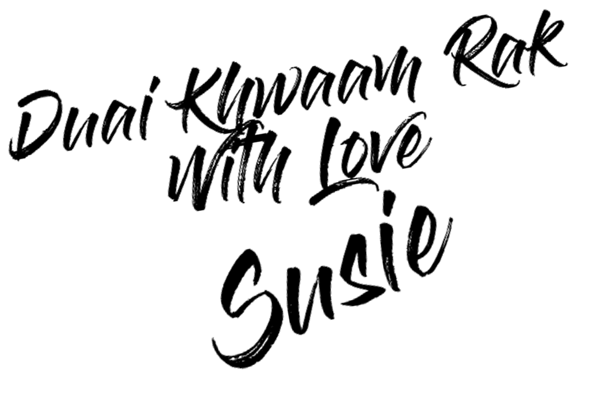 Susie's signature reading 'Duai Khwaan Rak, with love Susie