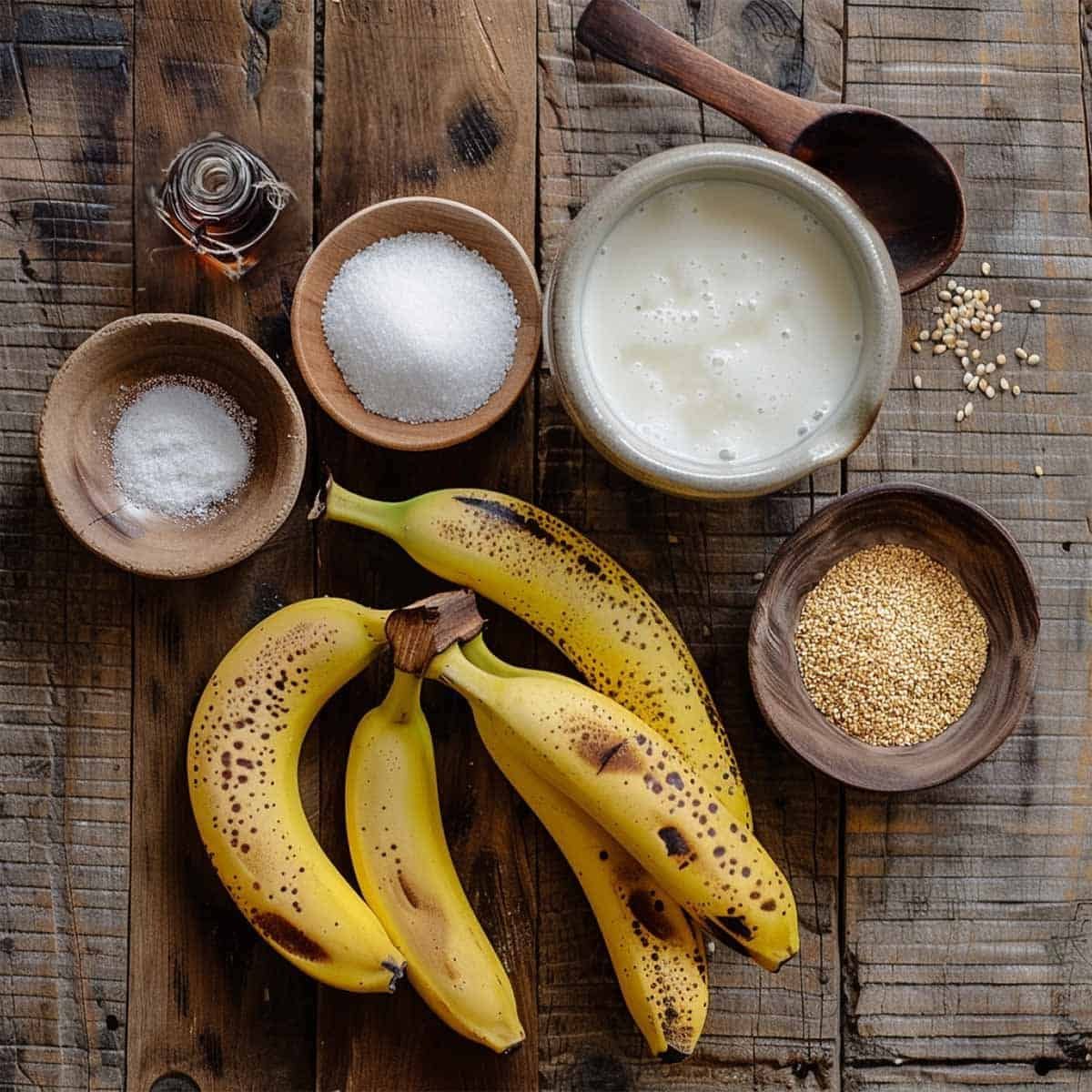 Ingredients for Bananas in Coconut Milk Dessert  (Kluay Buat Chee) on a rustic wood table.