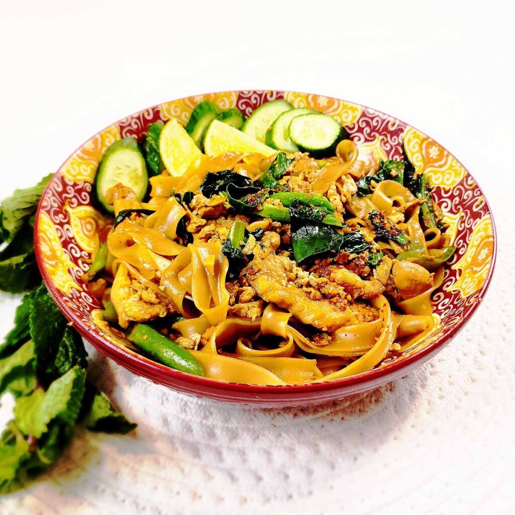 Steaming Pad See Ew with glossy noodles, broccoli, chicken and egg