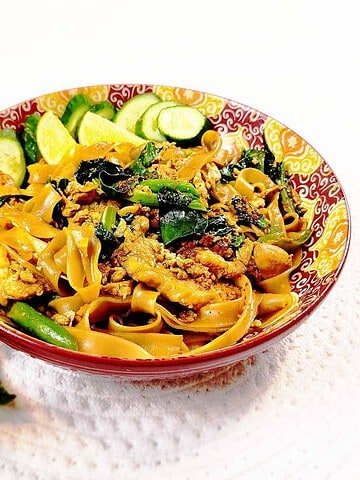 Steaming Pad See Ew with glossy noodles, broccoli, chicken and egg