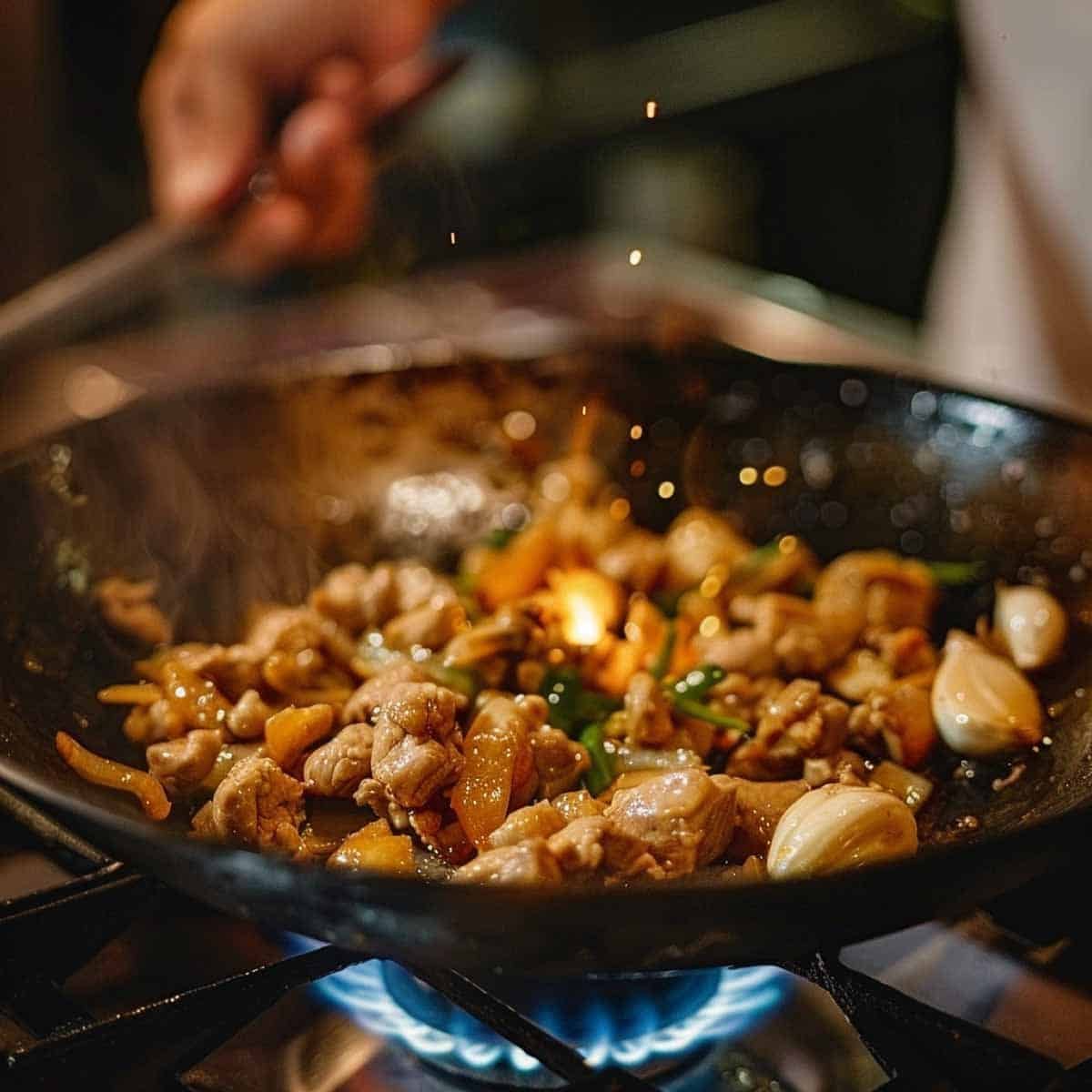 Cooking eggs and garlic in a wok.