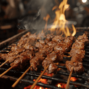 Moo Ping pork skewers cooking to perfection on an open flame grill