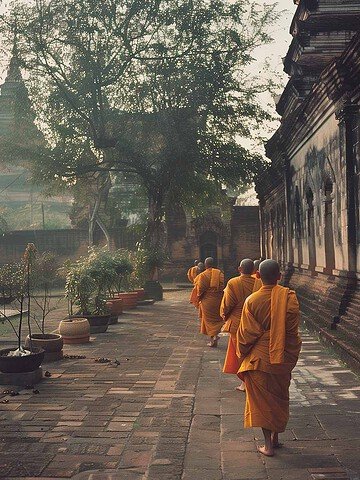 Thai Monks walking in a line at temple