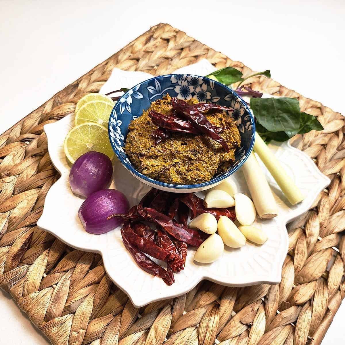 Fragrant Thai yellow curry in a decorative bowl topped with fresh herbs