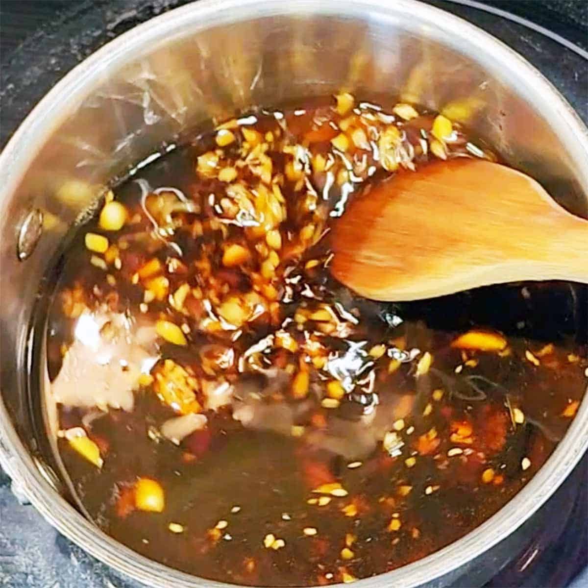 Stirring ingredients for Thai BBQ sauce 