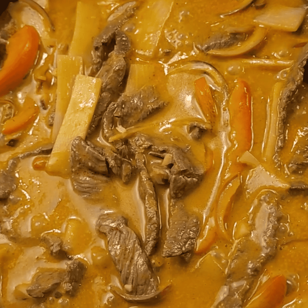 Thai Beef Red Curry simmering in pan