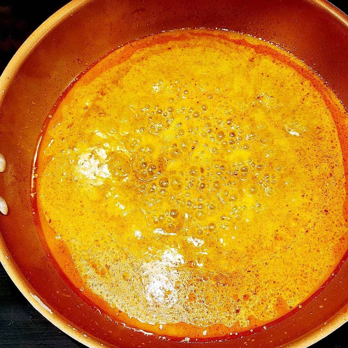 sauce simmering in pan 