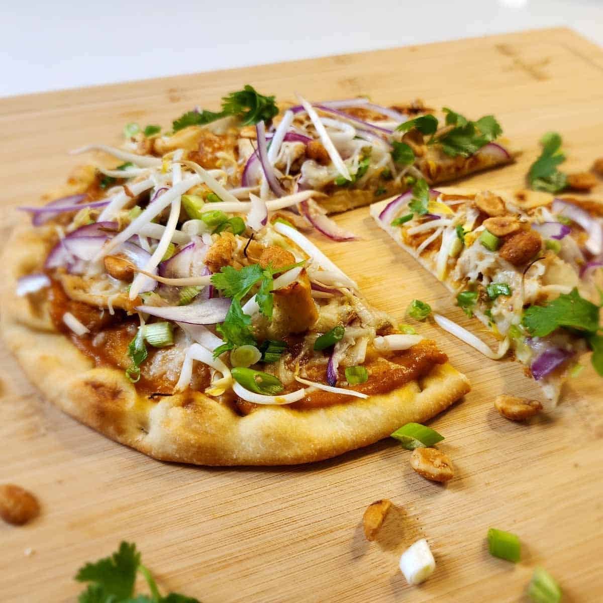 Thai Fusion Flatbread on bamboo cutting board 