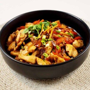 Thai Ginger Chicken in black bowl