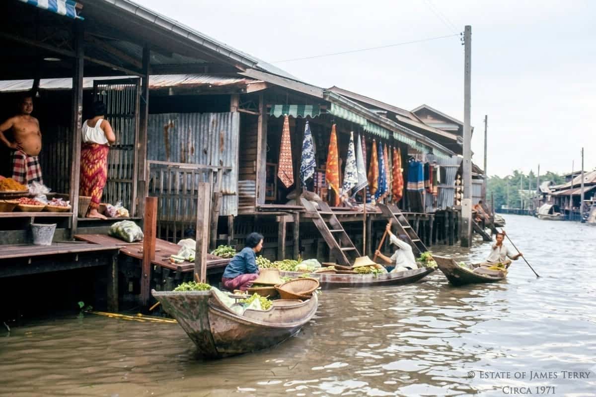 Thailand vintage photos of floating market vendors selling vegetables from wooden boats circa 1971